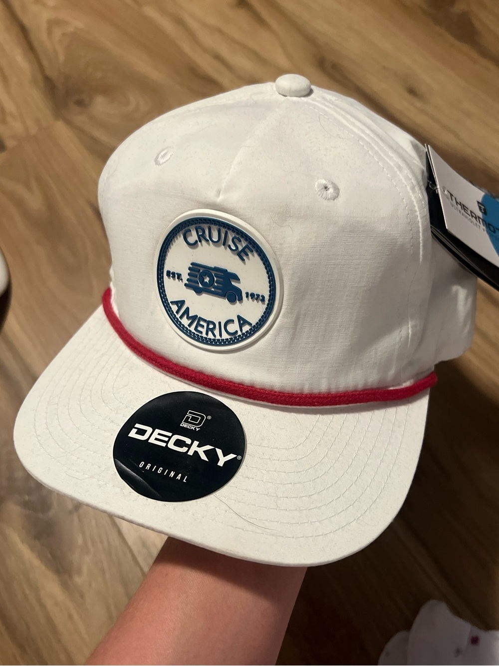 White 'Cruise America' Cap with Blue Logo and Red Trim